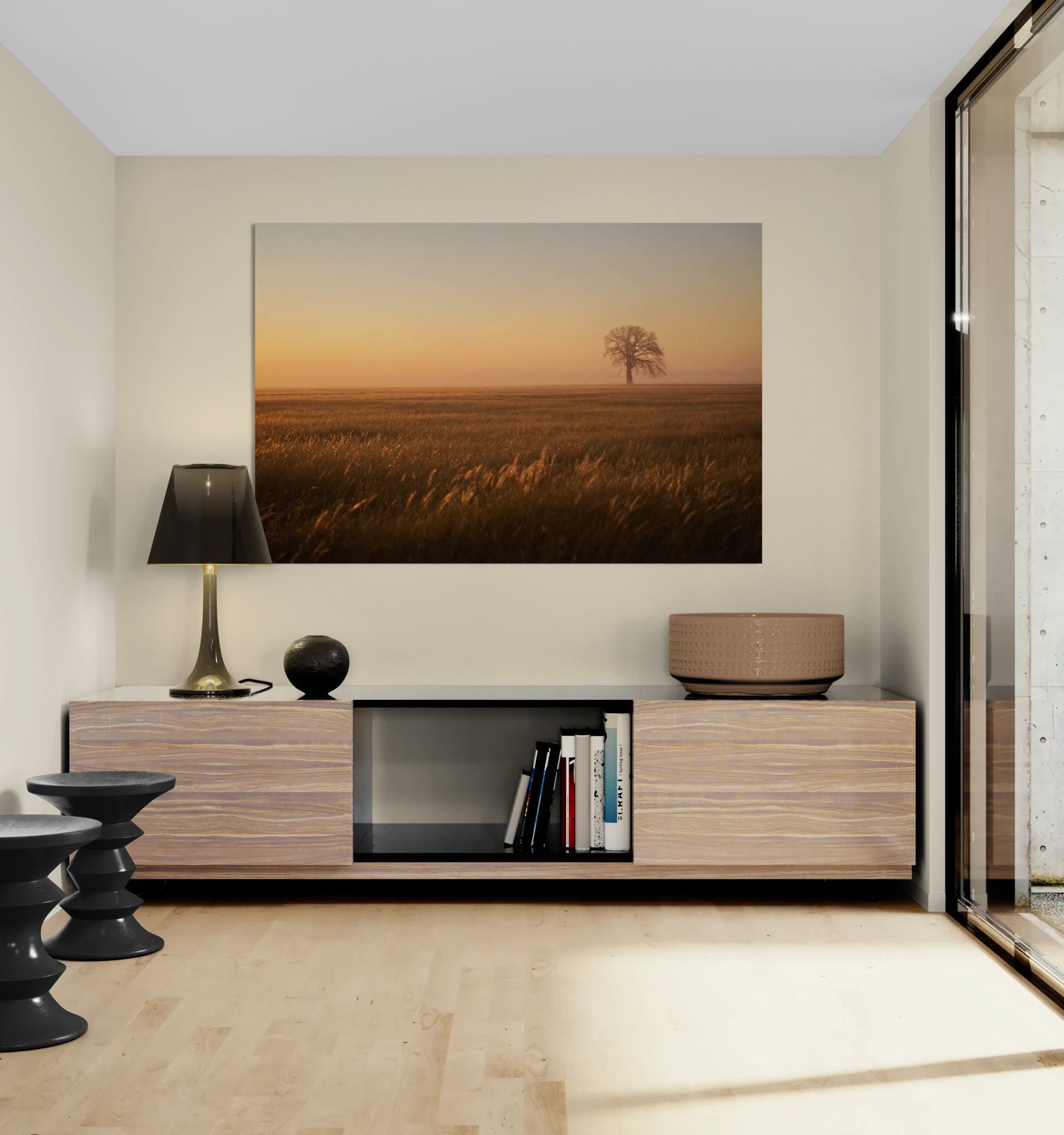 Golden field wall art in minimalist modern interior with wooden sideboard, black lamp, and warm neutral decor