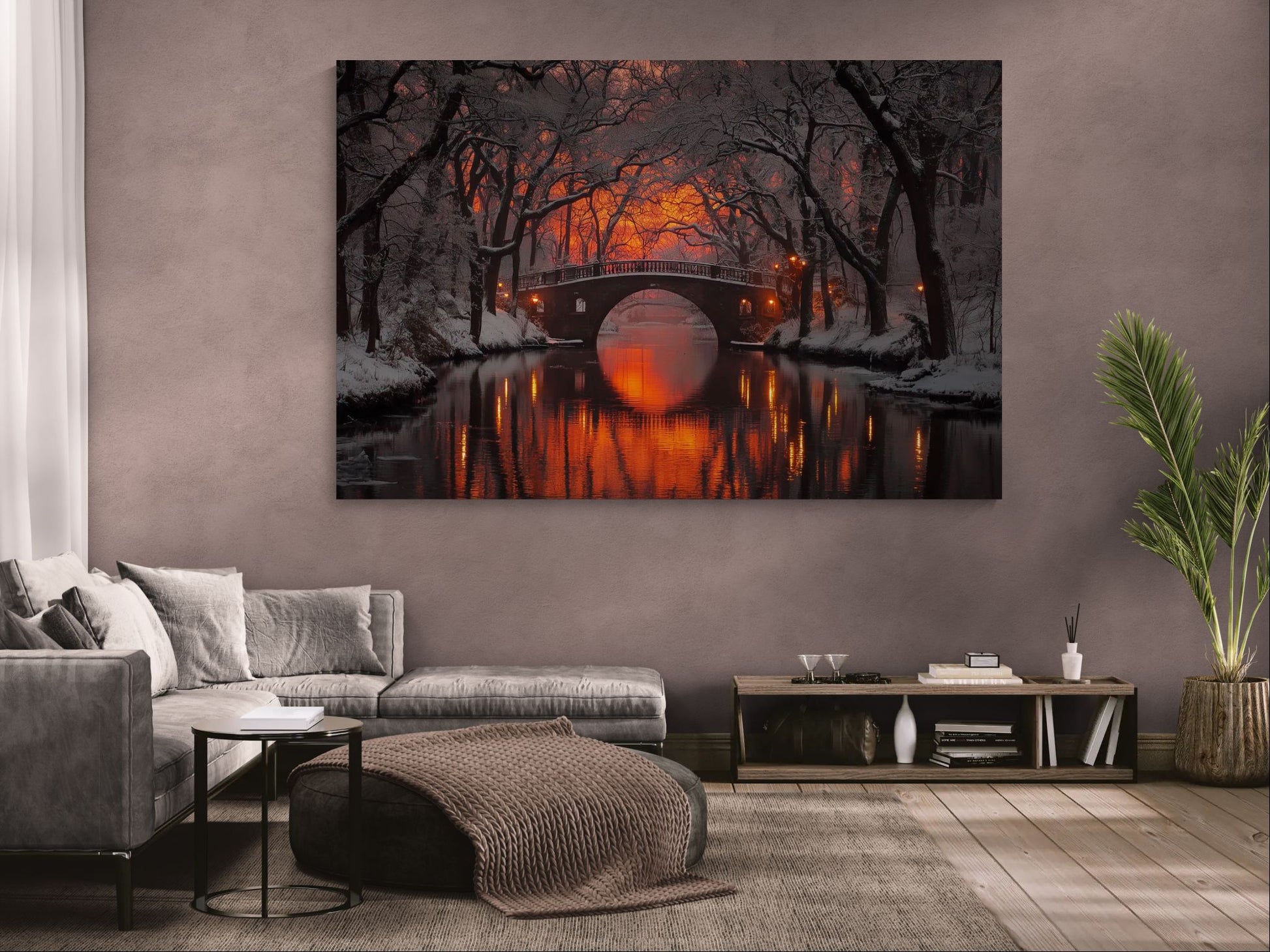 winter canvas wall art with glowing bridge reflected in water, displayed in a modern living room with neutral walls and wooden floor.